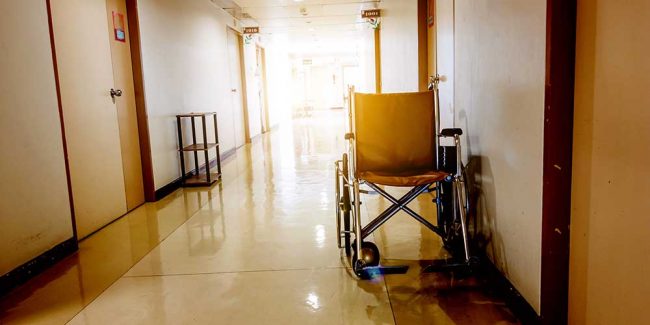 A-nursing-home-investigation-in-Milford,-Pike-County,-Pennsylvania-led-to-the-hospitalization-of-15-residents Vacant hall with wheelchair in a nursing home investigation in Milford, Pike County, Pennsylvania led to the hospitalization of 15 residents | Anzalone & Doyle Trial Lawyers